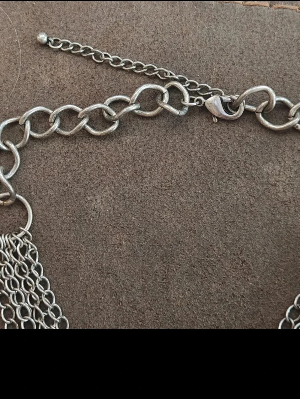 Silver Tone Multi Strand Chain Statement Necklace With a Faux Turquoise Stone